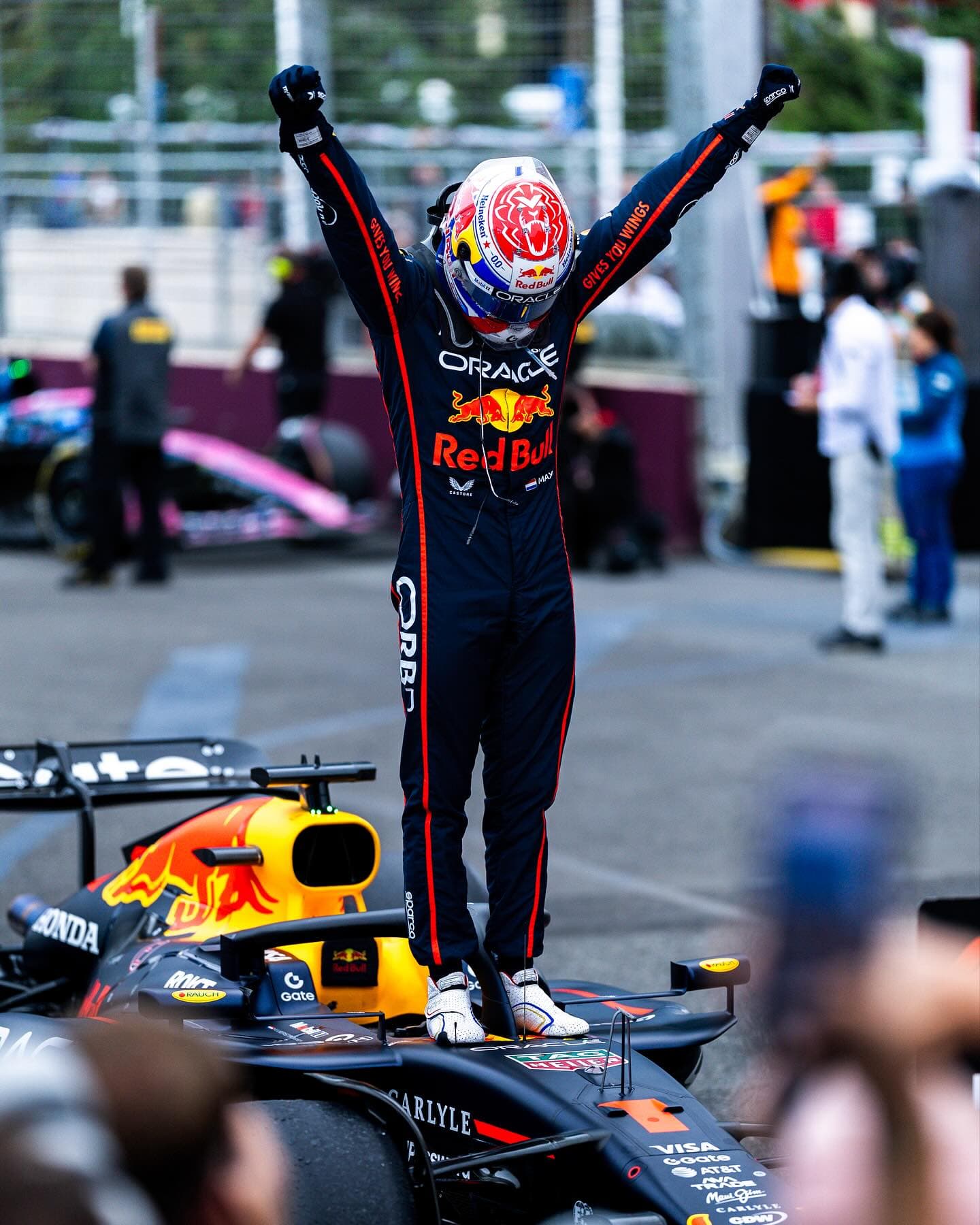 Max Verstappen celebrating on his Red Bull Racing car