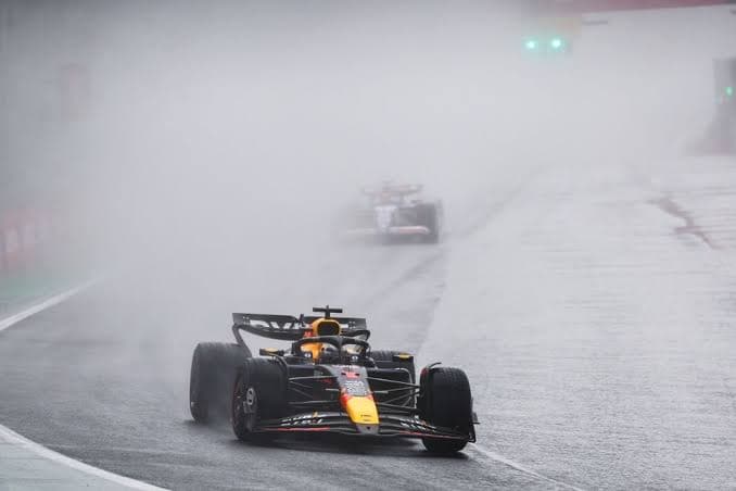 Max Verstappen racing in wet conditions at Interlagos
